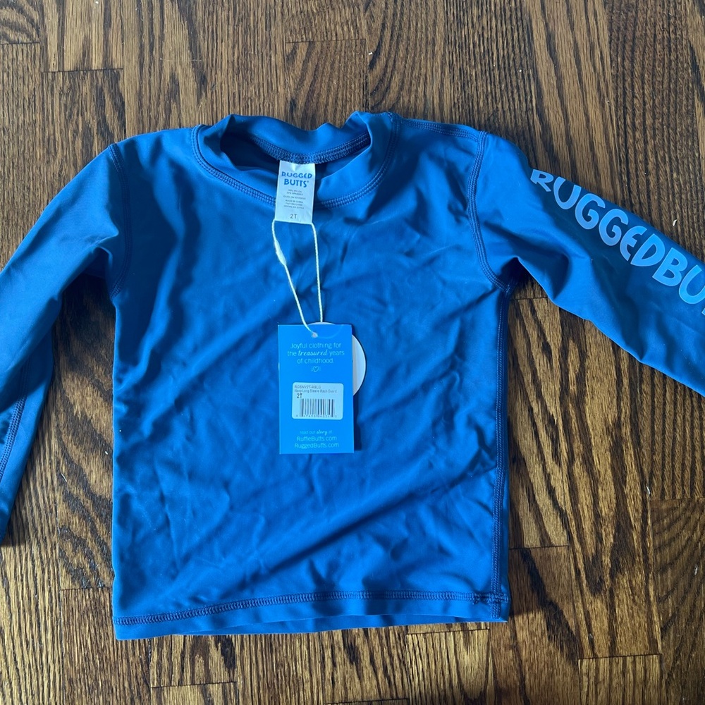 Brand new, never worn rugged butts rashguard